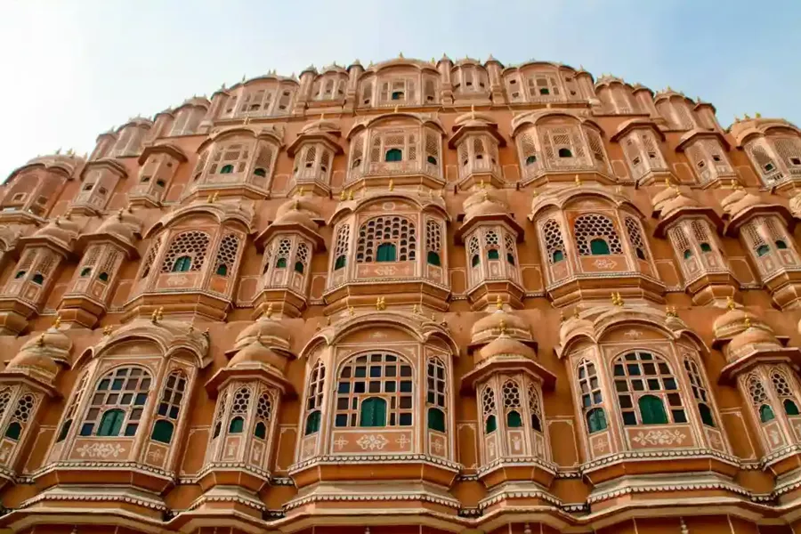 The iconic pink honeycomb facade of Hawa Mahal Jaipur